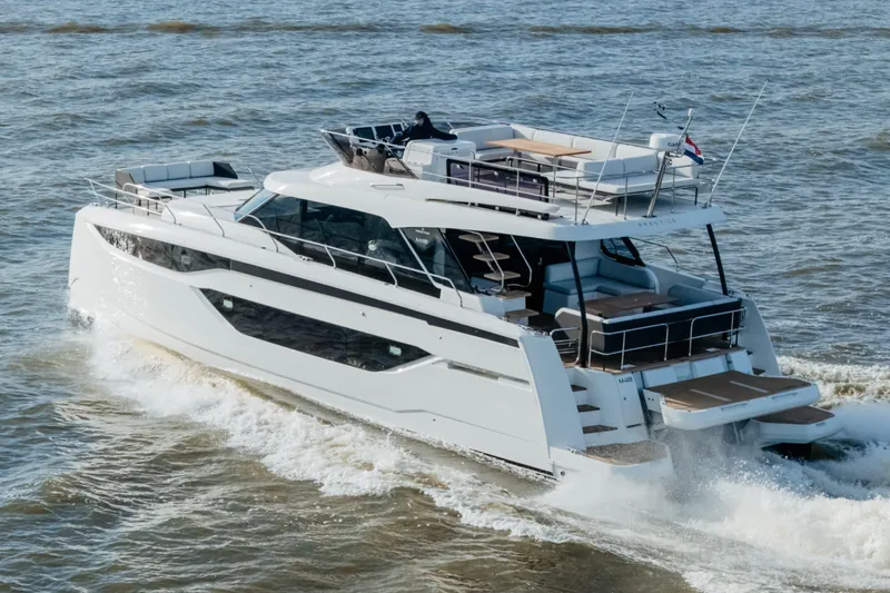  Yacht Photos Pics 2023 Prestige M48 Power Catamaran cruising on open water.