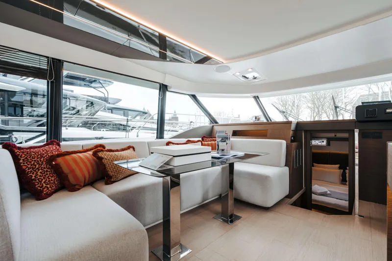  Yacht Photos Pics Luxurious interior of 2023 Prestige M48 Power Catamaran with modern seating and elegant decor.