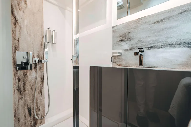  Yacht Photos Pics Modern bathroom in 2023 Prestige M48 Power Catamaran with sleek fixtures and elegant design.