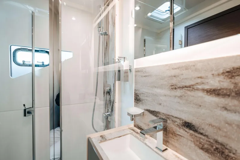  Yacht Photos Pics Luxurious bathroom in 2023 Prestige M48 Power Catamaran with modern fixtures and elegant design.