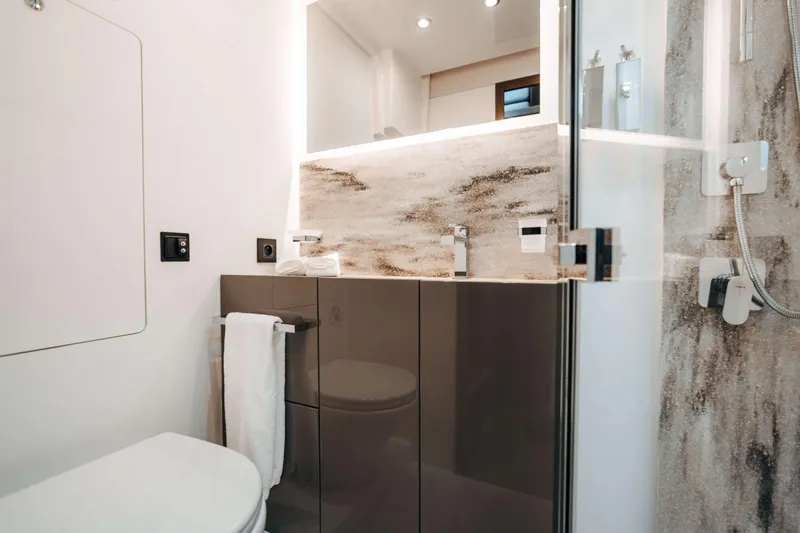  Yacht Photos Pics Modern bathroom interior on 2023 Prestige M48 Power Catamaran, featuring sleek design and elegant fixtures.
