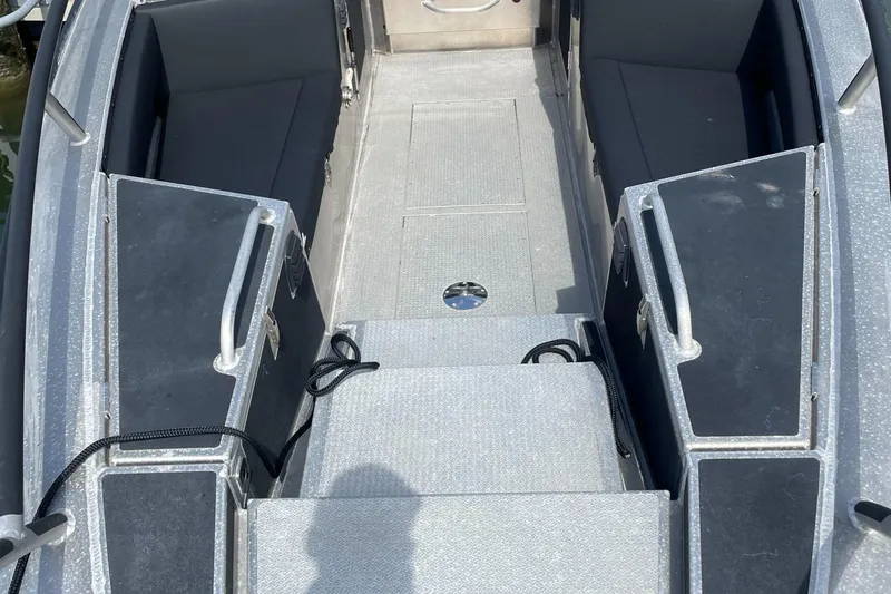  Yacht Photos Pics Interior view of 2024 Viggo C10 boat, featuring seating and storage compartments.