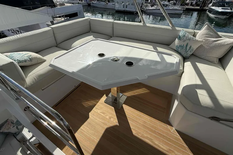  Yacht Photos Pics Luxurious seating area on 2026 Aventura 38 Motor Yacht with elegant table and cushions.