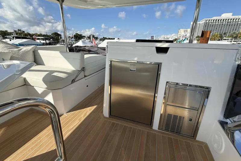  Yacht Photos Pics Aventura 38 Motor Yacht 2026 deck with seating and stainless steel appliances.