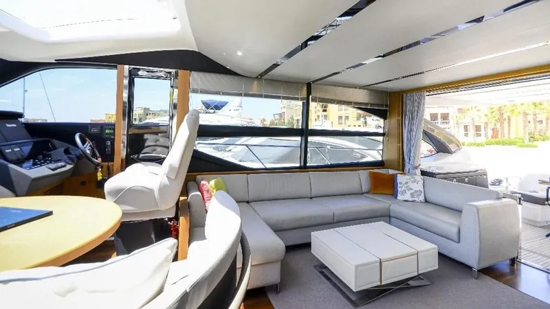  Yacht Photos Pics Luxurious interior of 2015 Princess S72 yacht with modern seating and panoramic windows.