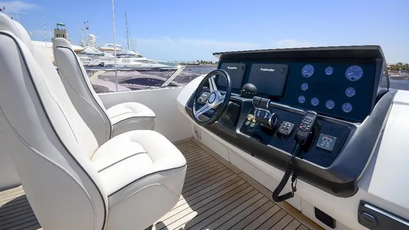  Yacht Photos Pics Helm of 2015 Princess S72 yacht with dual seats and advanced navigation controls.
