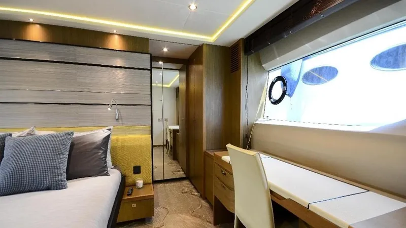  Yacht Photos Pics Luxurious interior of 2015 Princess S72 yacht with modern bedroom and desk area.