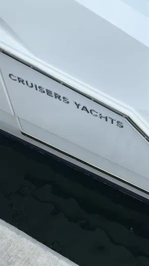  Yacht Photos Pics 2021 Cruisers Yachts 42 GLS, sleek design, docked at marina.