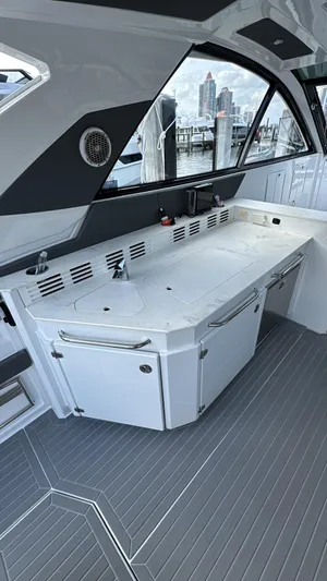  Yacht Photos Pics 2021 Cruisers Yachts 42 GLS interior with sleek kitchen and modern design.