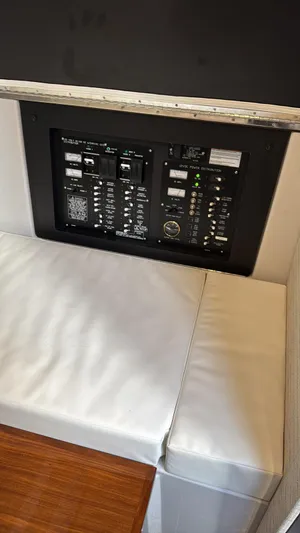  Yacht Photos Pics Electrical control panel on 2021 Cruisers Yachts 42 GLS with cushioned seating.
