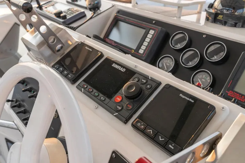 Too Many Options Yacht Photos Pics Control panel of a 1993 Sea Ray 550 Sedan Bridge with navigation instruments.