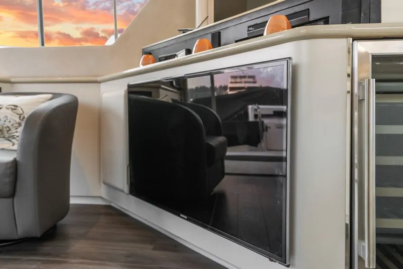 Too Many Options Yacht Photos Pics Interior of 1993 Sea Ray 550 Sedan Bridge yacht with modern amenities and sunset view.