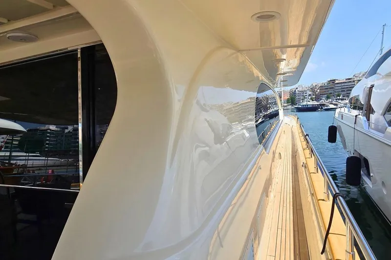 M/y Balkan Yacht Photos Pics Side view of a 2007 Falcon 102 yacht docked in a marina.