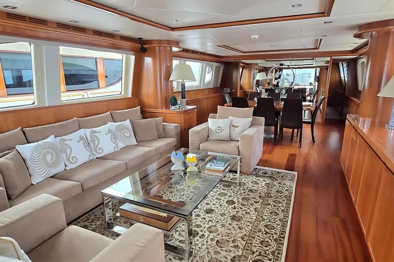 M/y Balkan Yacht Photos Pics Luxurious interior of 2007 Falcon 102 yacht with elegant seating and dining area.