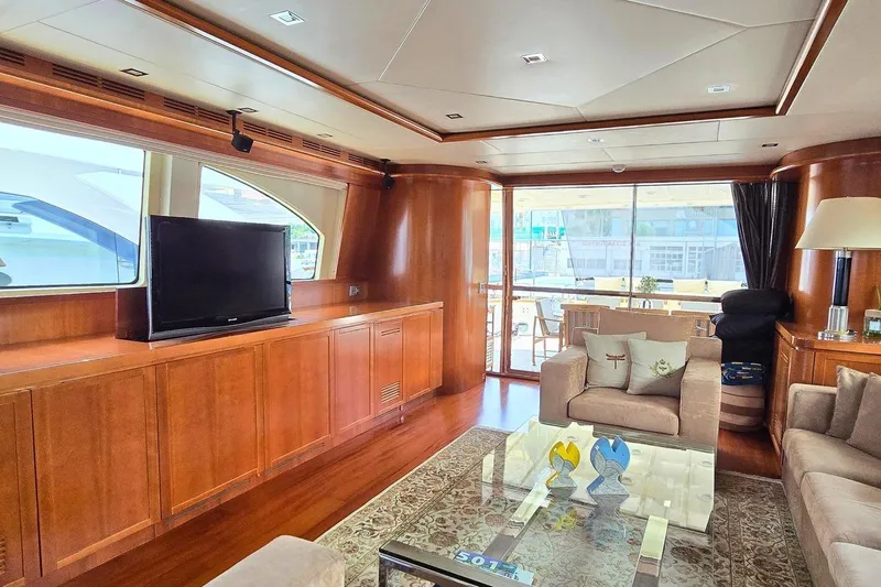 M/y Balkan Yacht Photos Pics Luxurious interior of 2007 Falcon 102 yacht with elegant wood paneling and modern furnishings.