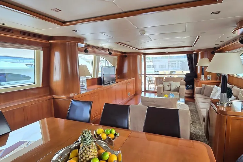 M/y Balkan Yacht Photos Pics Luxurious interior of 2007 Falcon 102 yacht with elegant wood finishes and modern furnishings.