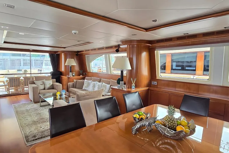 M/y Balkan Yacht Photos Pics Luxurious interior of 2007 Falcon 102 yacht with elegant seating and dining area.