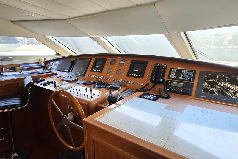 M/y Balkan Yacht Photos Pics Cockpit of 2007 Falcon 102 yacht with navigation instruments and steering wheel.