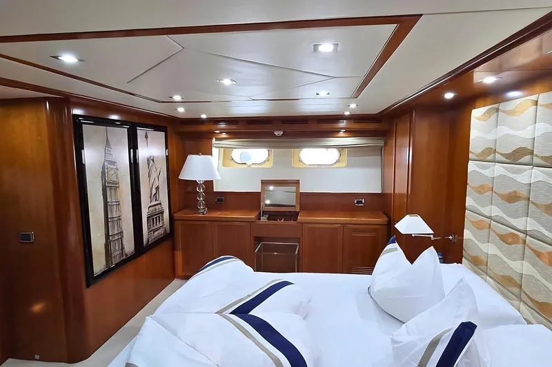 M/y Balkan Yacht Photos Pics Luxurious cabin interior of 2007 Falcon 102 yacht with elegant wood finishes.