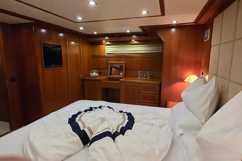 M/y Balkan Yacht Photos Pics Luxurious cabin interior of 2007 Falcon 102 yacht with elegant wood paneling.