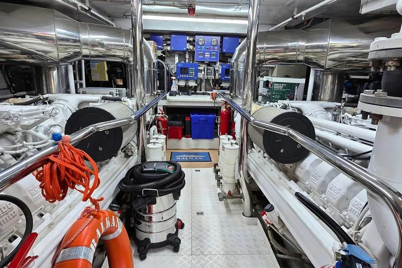 M/y Balkan Yacht Photos Pics Engine room of a 2007 Falcon 102 yacht, featuring machinery and safety equipment.