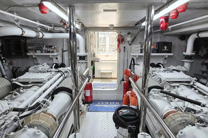 M/y Balkan Yacht Photos Pics Engine room of a 2007 Falcon 102 yacht, featuring dual engines and safety equipment.