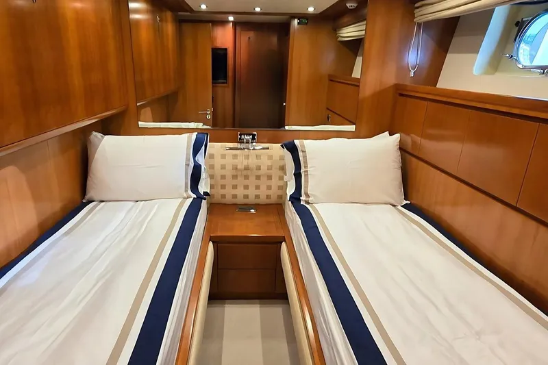 M/y Balkan Yacht Photos Pics Luxurious twin cabin interior on 2007 Falcon 102 yacht, featuring elegant wood paneling.