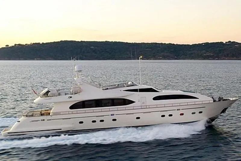M/y Balkan Yacht Photos Pics Luxury Falcon 102 yacht cruising on the sea at sunset, 2007 model.