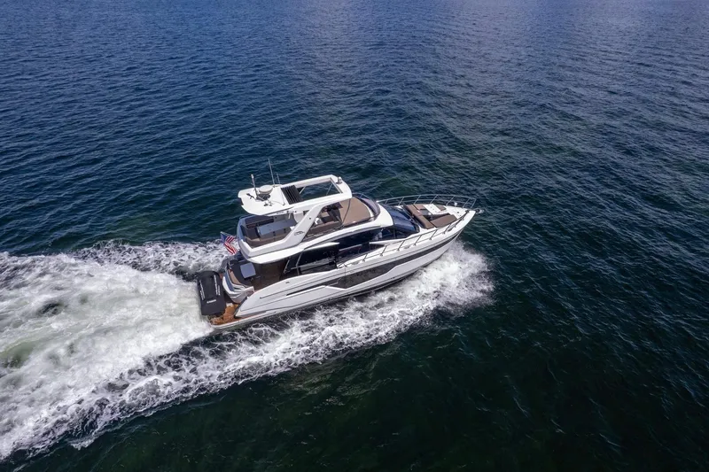 Mangogo Yacht Photos Pics Aerial view of 2021 Galeon 500 Fly yacht cruising on open water.