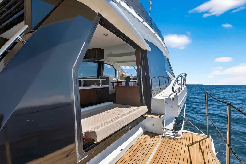 Mangogo Yacht Photos Pics 2021 Galeon 500 Fly yacht with open deck, luxurious interior, and ocean view.