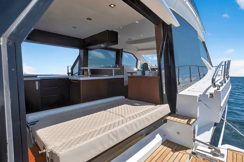 Mangogo Yacht Photos Pics Luxurious 2021 Galeon 500 Fly yacht interior with open deck and ocean view.
