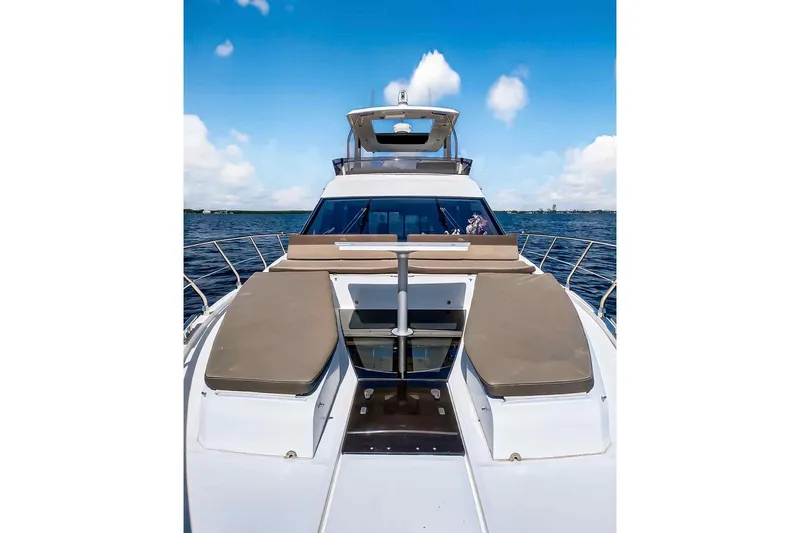 Mangogo Yacht Photos Pics 2021 Galeon 500 Fly yacht on open water under blue sky.