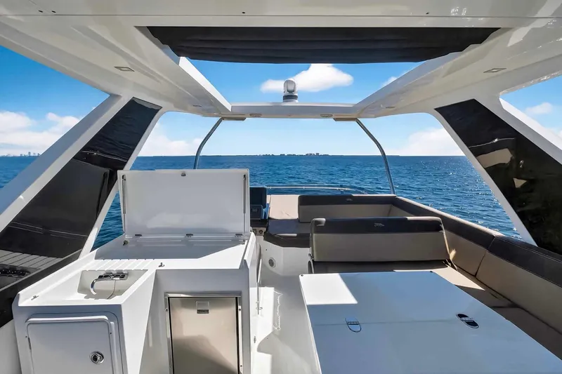 Mangogo Yacht Photos Pics 2021 Galeon 500 Fly yacht interior with ocean view, featuring sleek design and spacious seating.