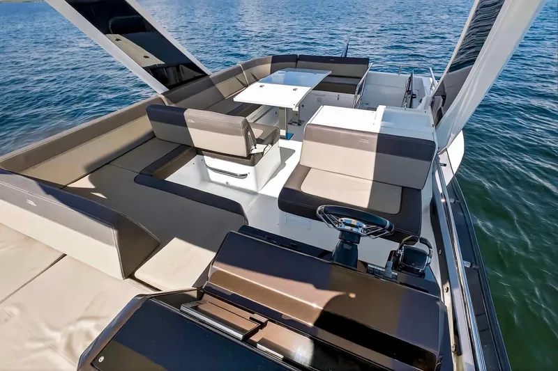 Mangogo Yacht Photos Pics 2021 Galeon 500 Fly yacht interior with spacious seating and helm, overlooking the water.