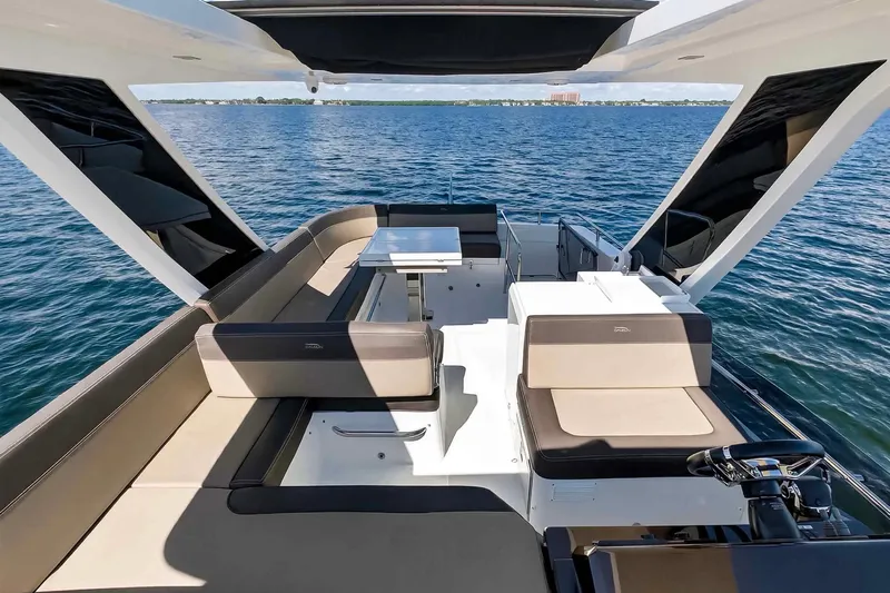 Mangogo Yacht Photos Pics Luxurious 2021 Galeon 500 Fly yacht interior with elegant seating and ocean view.
