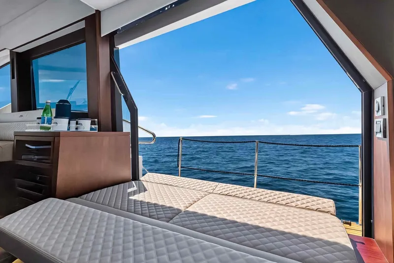 Mangogo Yacht Photos Pics Luxurious 2021 Galeon 500 Fly yacht interior with ocean view and sunbathing area.