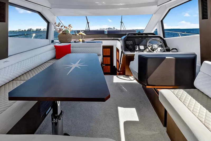 Mangogo Yacht Photos Pics Luxurious interior of 2021 Galeon 500 Fly yacht with elegant seating and helm.
