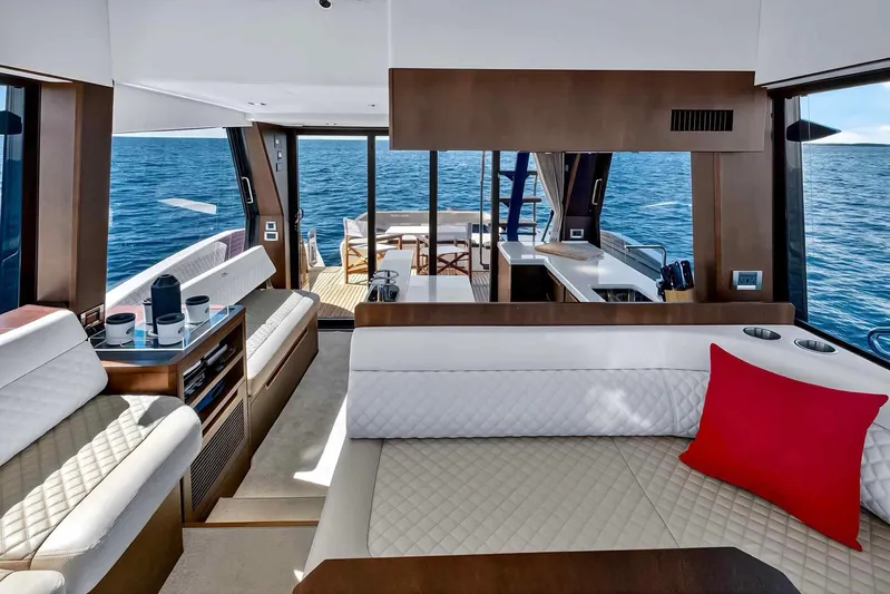 Mangogo Yacht Photos Pics Luxurious interior of 2021 Galeon 500 Fly yacht with modern seating and ocean view.