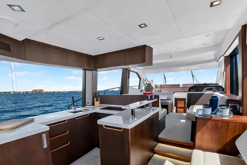 Mangogo Yacht Photos Pics Luxurious interior of 2021 Galeon 500 Fly yacht with modern kitchen and ocean view.