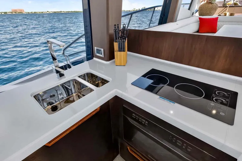 Mangogo Yacht Photos Pics Modern kitchen on 2021 Galeon 500 Fly yacht with sleek countertops and appliances.
