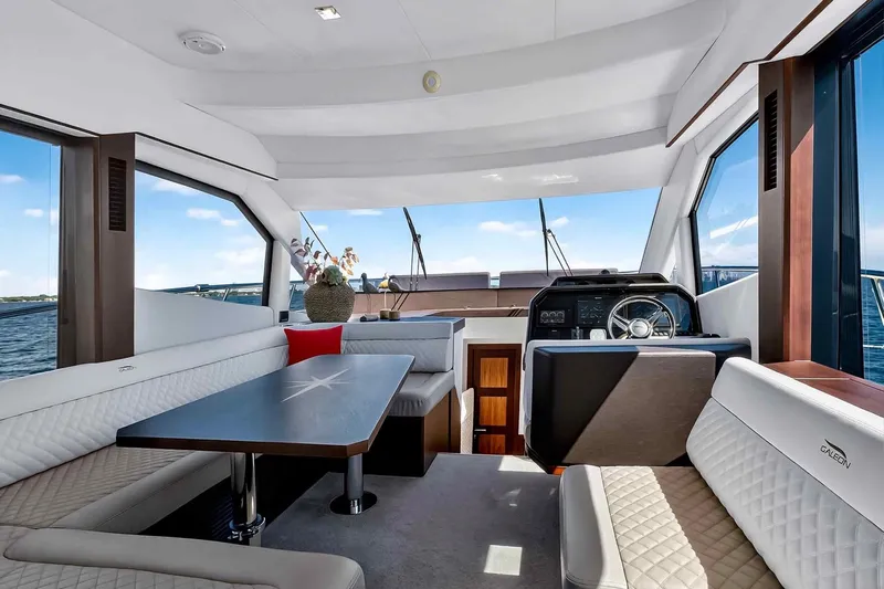 Mangogo Yacht Photos Pics Luxurious interior of 2021 Galeon 500 Fly yacht with elegant seating and helm.