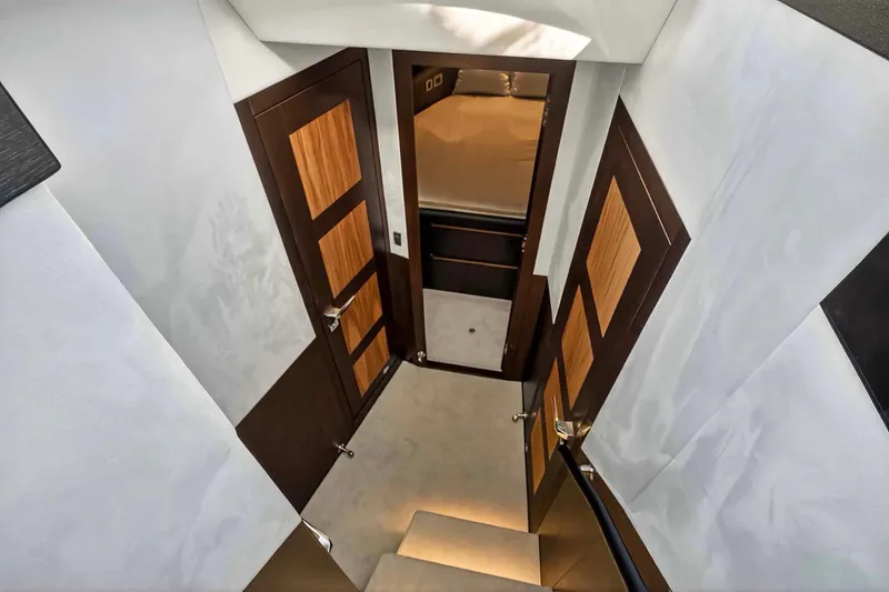 Mangogo Yacht Photos Pics Interior view of 2021 Galeon 500 Fly yacht, featuring elegant wooden doors and modern design.