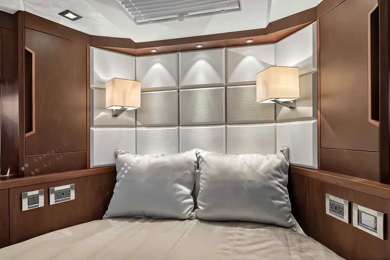Mangogo Yacht Photos Pics Luxurious interior cabin of 2021 Galeon 500 Fly yacht with elegant lighting and plush bedding.