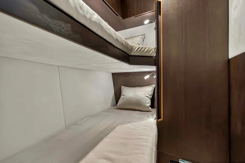 Mangogo Yacht Photos Pics 2021 Galeon 500 Fly yacht interior with cozy bunk beds and modern lighting.