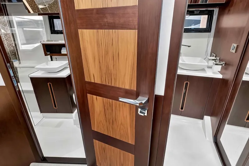 Mangogo Yacht Photos Pics Luxurious bathroom interior on 2021 Galeon 500 Fly yacht, featuring modern wood finishes.