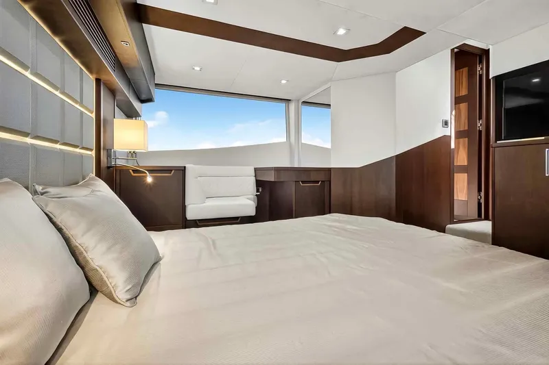 Mangogo Yacht Photos Pics Luxurious bedroom interior of 2021 Galeon 500 Fly yacht with modern design and large windows.