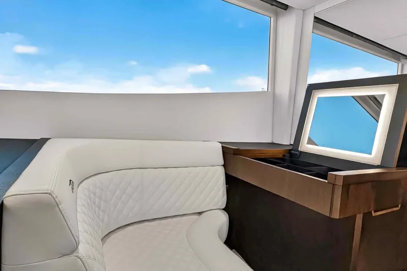 Mangogo Yacht Photos Pics Luxurious interior of 2021 Galeon 500 Fly yacht with elegant seating and vanity.