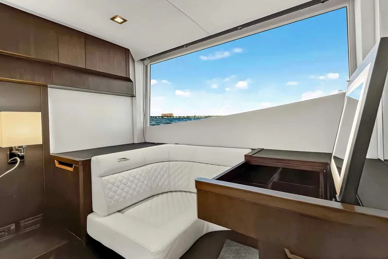 Mangogo Yacht Photos Pics Luxurious interior of 2021 Galeon 500 Fly yacht with elegant seating and ocean view.
