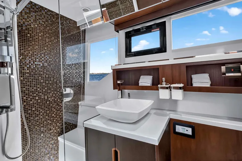 Mangogo Yacht Photos Pics Luxurious bathroom interior of 2021 Galeon 500 Fly yacht with modern fixtures and ocean view.
