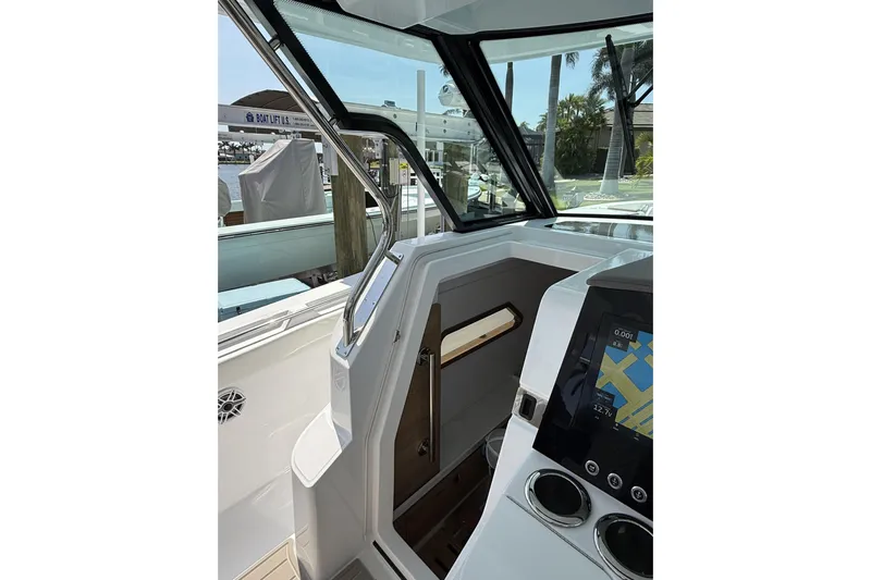  Yacht Photos Pics 2024 Bertram 39 CC boat interior with navigation display and sleek design.